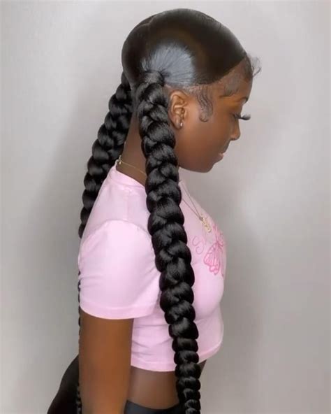 2 low braided ponytails